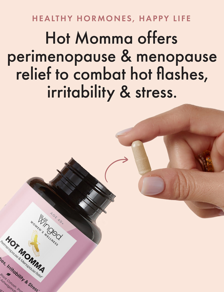 A woman removing a single Winged Wellness Hot Momma Menopause Support Supplement capsule from the bottle