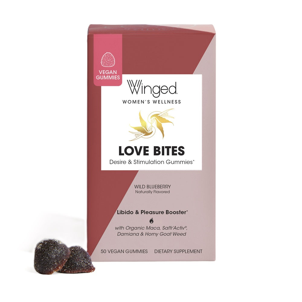 A box of Winged Wellness Love Bites Desire & Libido Gummies with 2 wild blueberry gummies next to it
