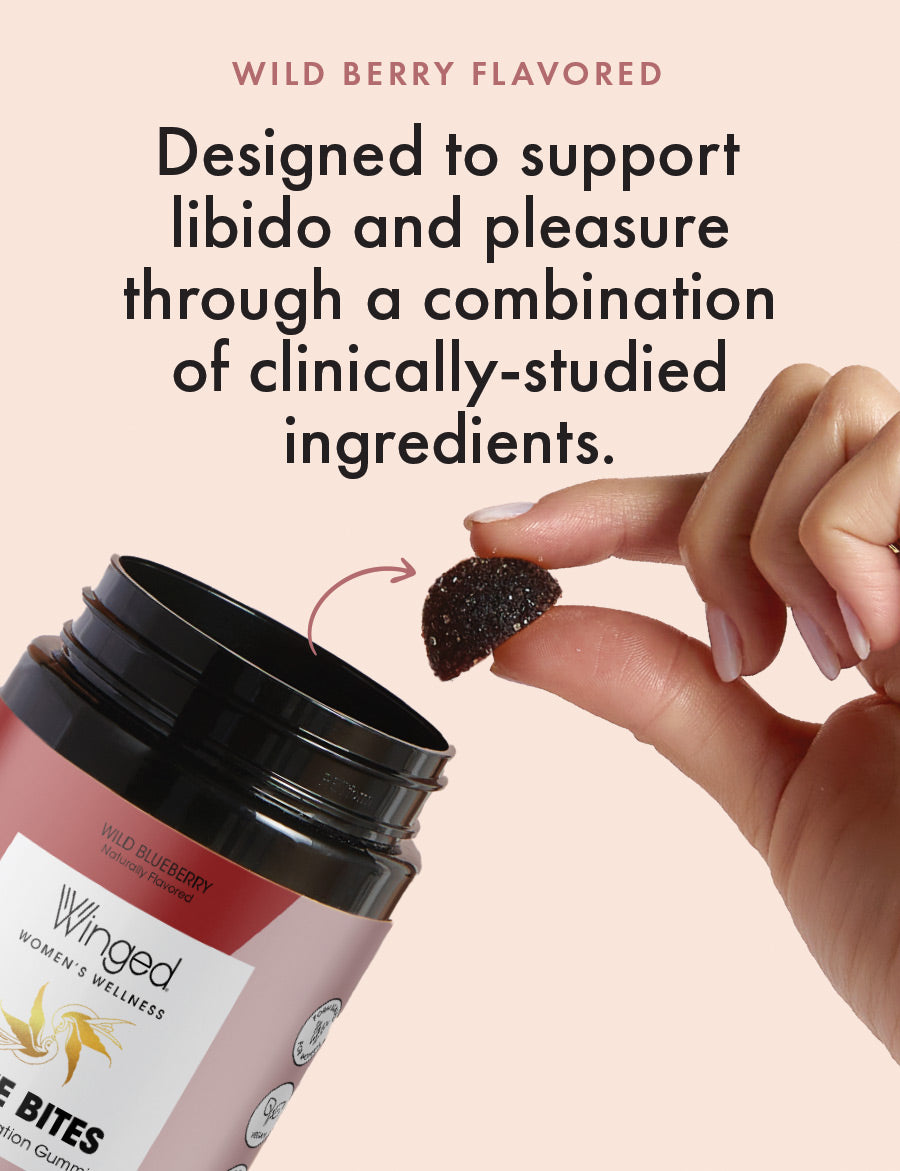 A woman removing a single Winged Wellness Love Bites Desire & Libido Gummy from the container