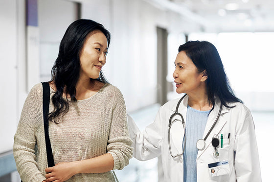 A female patient and doctor engaged in conversation, emphasizing the importance of asking questions during your menopause appointment.