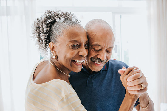 older couple shares a dance together as a form of intimacy during menopause