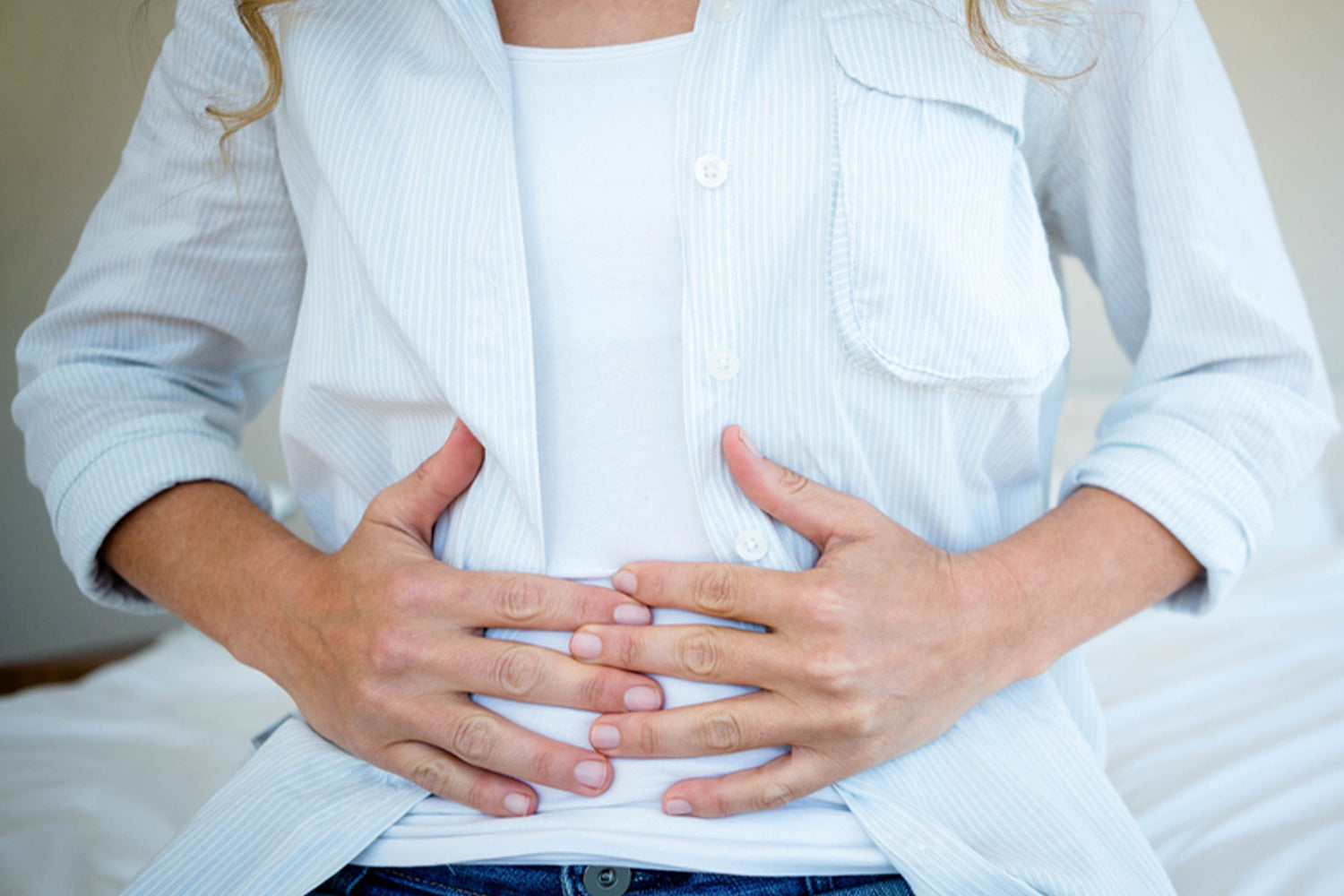 Tame your perimenopause belly bloat by learning simple tips from Versalie