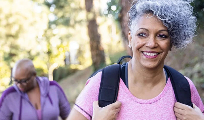 Two woman enjoying time outdoors after discovering menopause mobility support products on Versalie.com